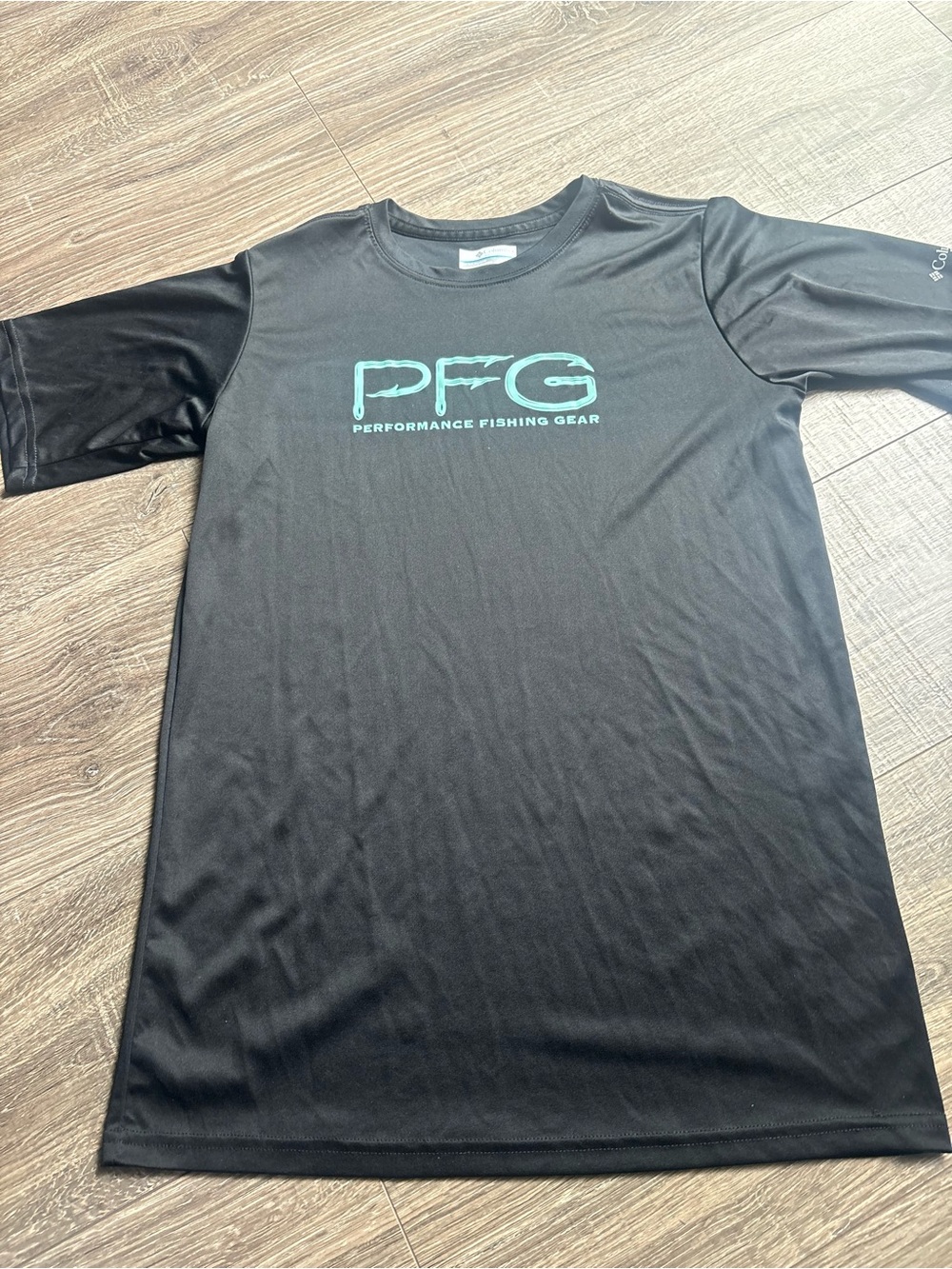 Columbia PFG Short-Sleeve Performance Shirt in Black with Teal Logo